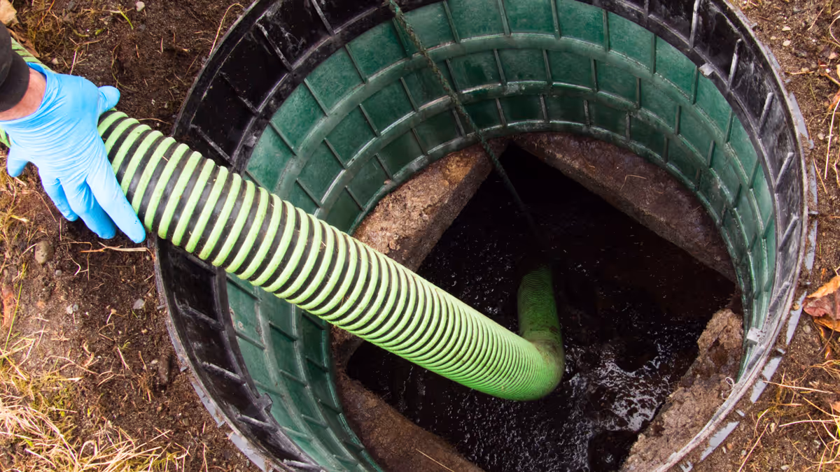 A Cobra Septic technician pumping a residential septic tank
